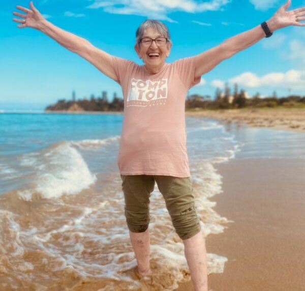 Cheerful person enjoying the beach waves