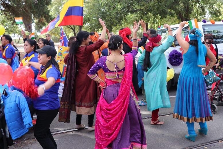 Cultural parade with colourful traditional costumes.