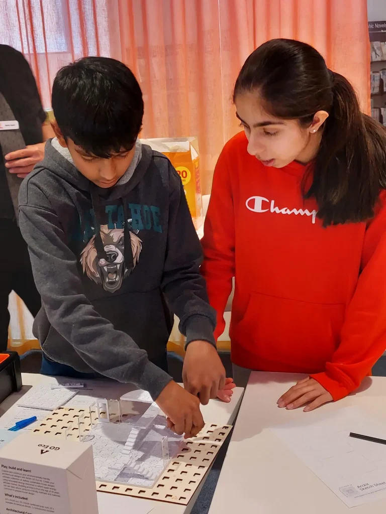 Kids working on a science project together.