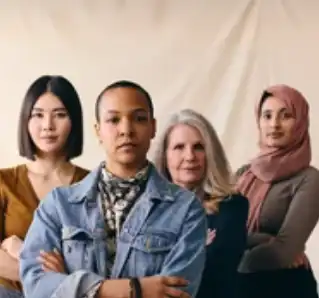 Diverse group of four confident women standing together.