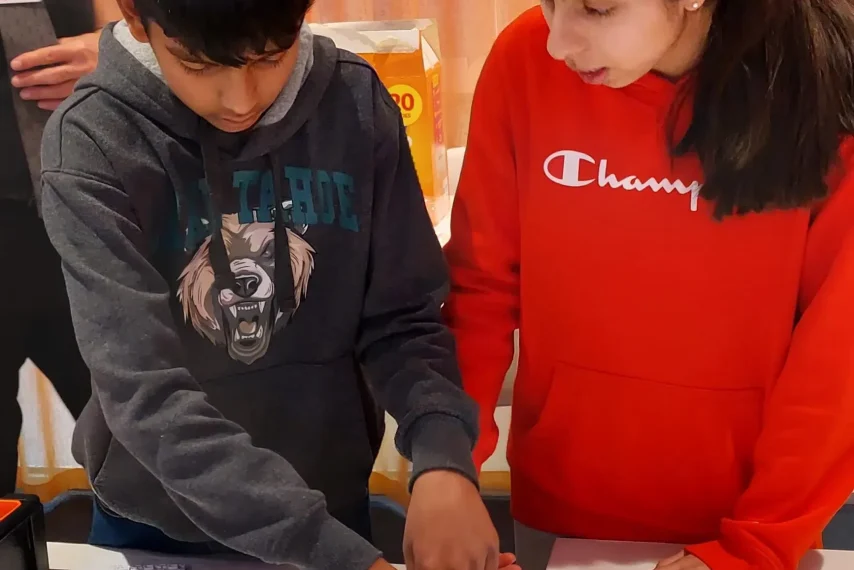 Kids working on a science project together.