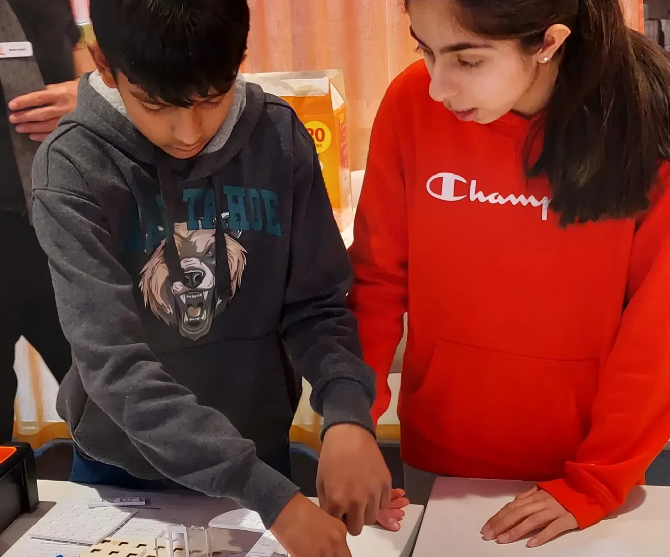 Kids working on a science project together.