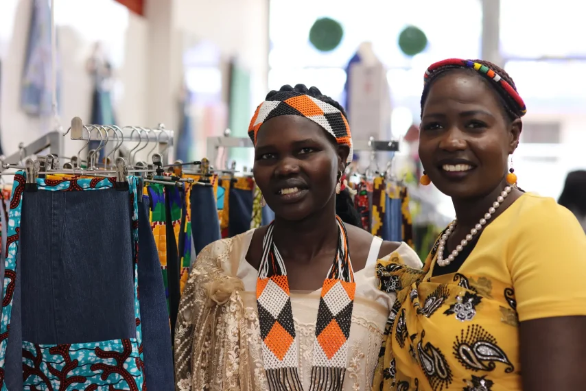 Women in colourful clothing at fabric store