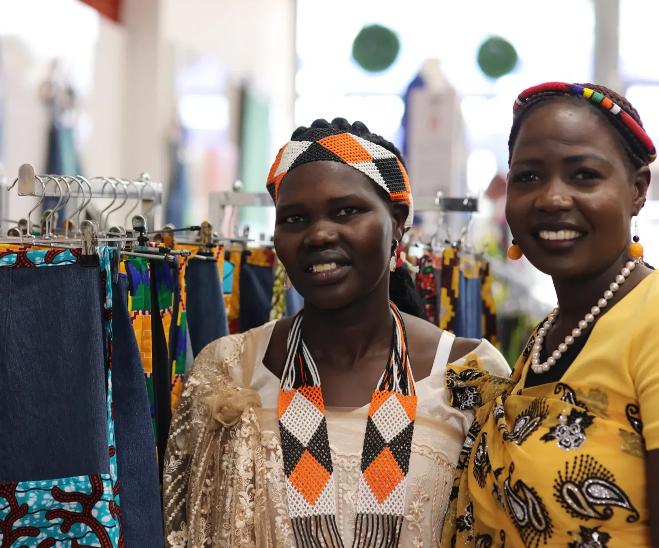 Women in colourful clothing at fabric store