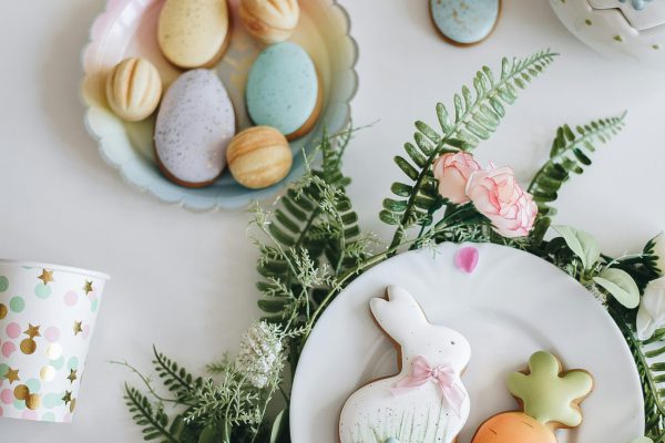 Easter cookies and decorations on white background.