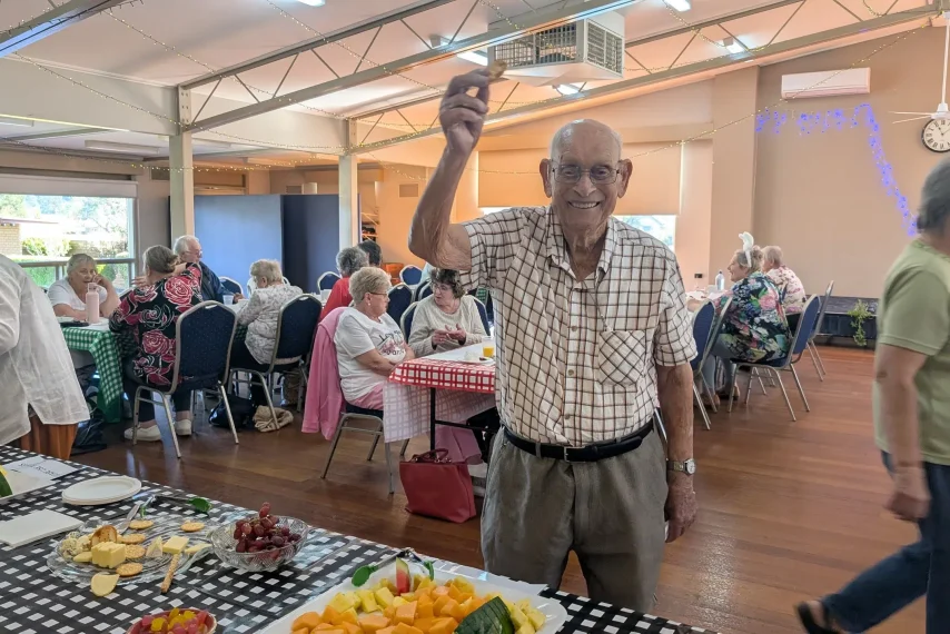 Seniors socialising at community hall Melbourne event.
