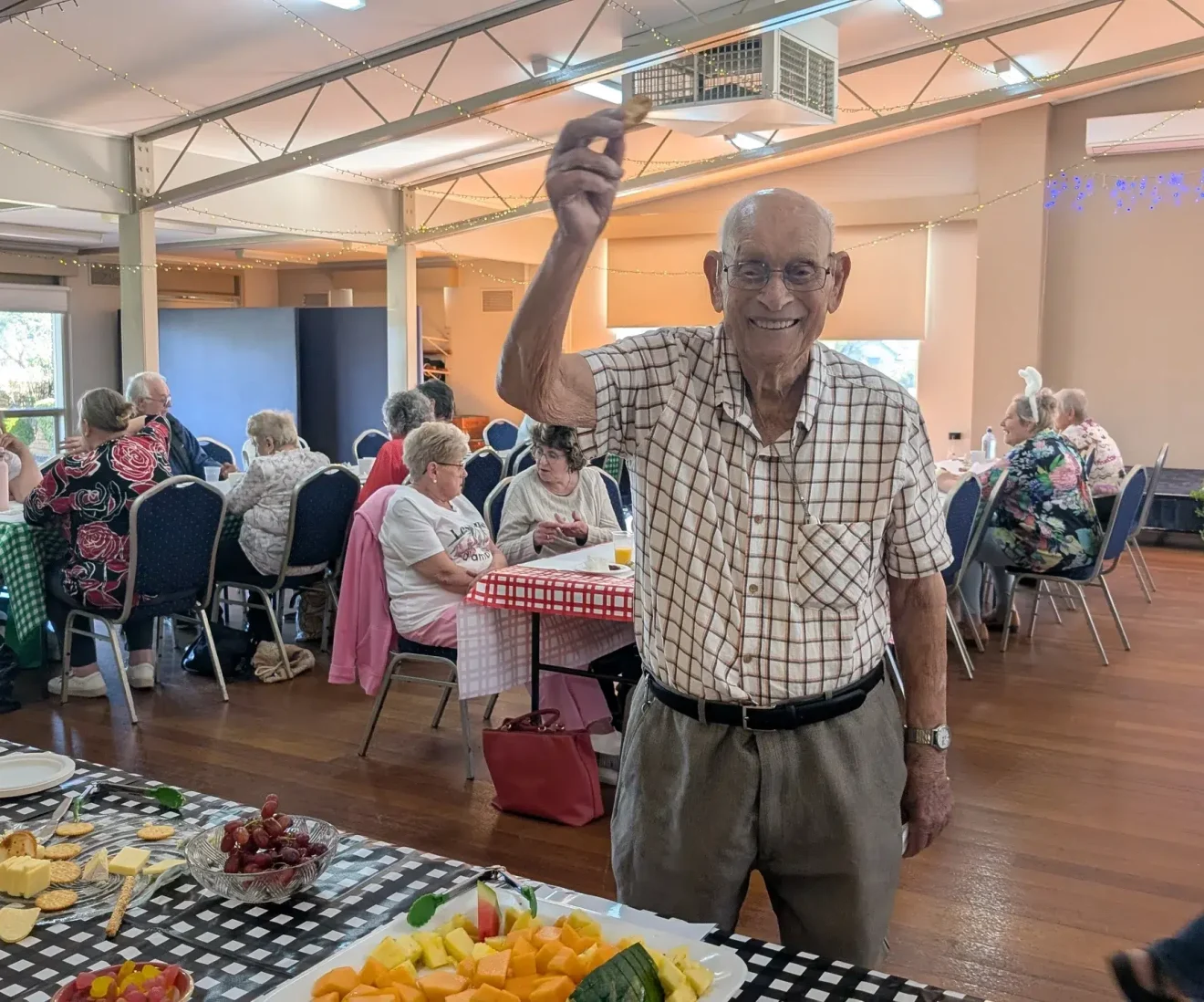 Seniors socialising at community hall Melbourne event.