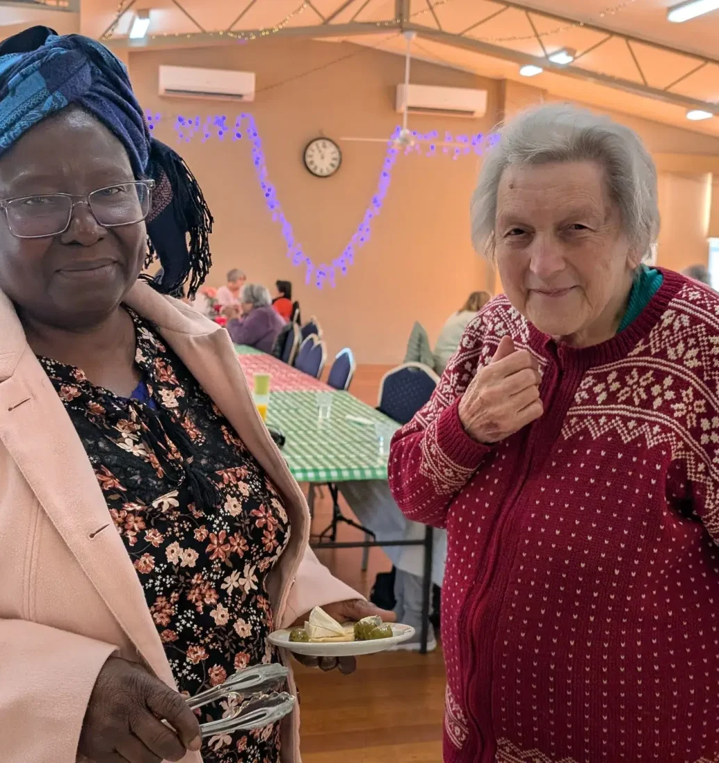 Two women at senior community event.